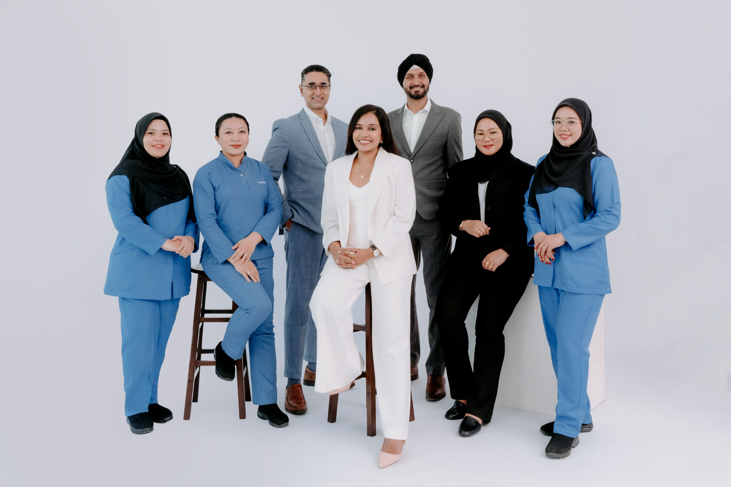 The team of Jasbir Dental Specialist Melaka, Dr. Manveen, the specialist orthodontist, Dr. Niba, and Dr. Dalvin, the general dental surgeons, along with their staff